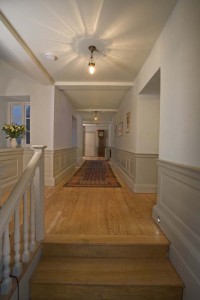 The first floor landing in peaceful, muted tones and with a stunning oak floor