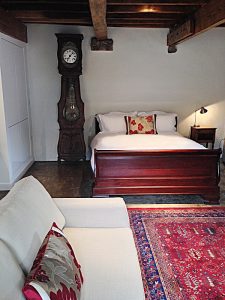 One of the large barn bedrooms with it's own sitting area at Devon Farmhouse in south Devon