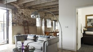 Character filled and spacious sitting and dining area in the courtyard setting of Devon Farmhouse barns.