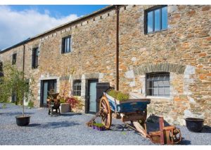 Devon Farmhouse has a charming courtyard area for the barn bedrooms, to give extra accommodation for groups larger than 16