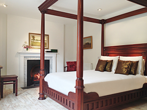 Handsome 4 poster bed with beautiful linen at Devon Farmhouse, in south Devon, part of The Big House Company