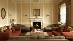 The comfortable sofas and cosy log fire make this a very inviting space to enjoy a house party with friends and family