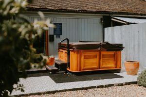 Dorset Party House - a large hot tub to relax in, just outside the games room