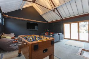 The games room has wide screen tv, table football and pool table