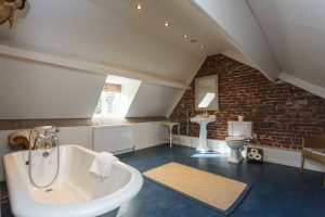 Bedroom 7 ensuite is very spacious with a roll top bath