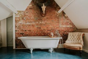 A stunning bathroom with roll top bath for a relaxing soak during your stay