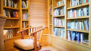 The small library has a secret doorway from the oak panelled hallway at Tatham House