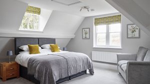 Cosy and comfortable attic bedroom for 2 guests at this luxury house rental.