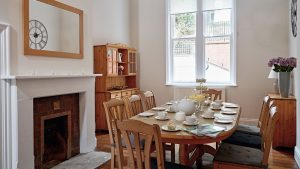 The sunny breakfast room is perfect for a big group of family or friends.