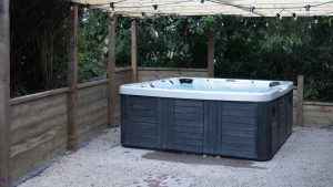 Enjoy the hot tub in a sheltered position in the garden