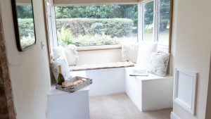 A cosy window seat to enjoy the garden view