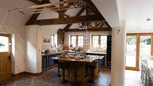 The country style kitchen links to the dining area for a lovely open plan feel