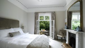 Bedroom 2 is a cosy room with kingsize bed and floor to ceiling windows