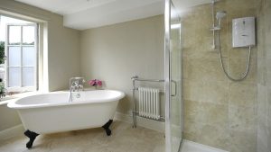 A pretty roll top bath to fill with bubbles plus a shower in this family bathroom