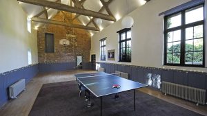 The large games room with table tennis, basketball hoop and plenty of space for dancing after dinner